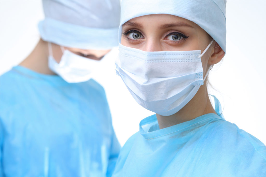 Orthopedic Surgeon in mask performing operation