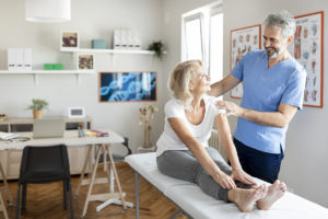 Woman getting treated by an orthopedic doctor.