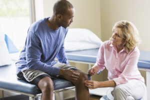 Patient taking consultation with knee doctor