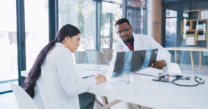 orthopedic doctors discussing patients X-ray