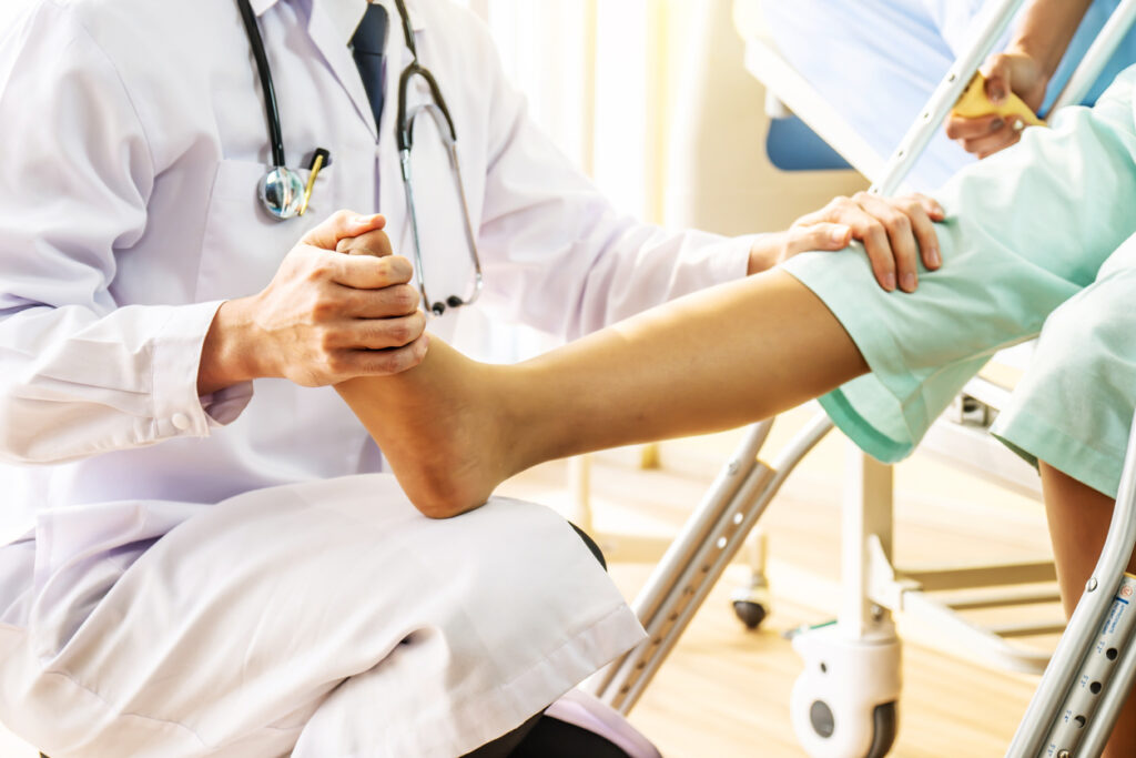 orthopedic Doctor examining of the leg in orthopedic clinic