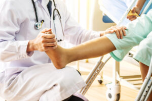orthopedic Doctor examining of the leg in orthopedic clinic