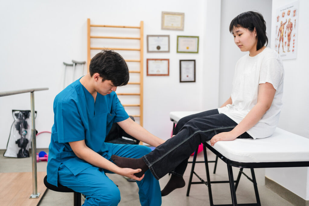 Teenager girl going to the sports medicine doctor with leg pain