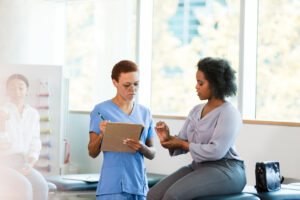 patient discuses wrist sprain with orthopedic doctor