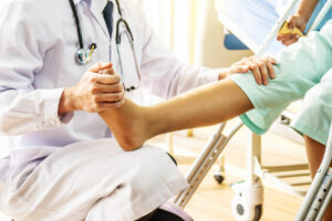 Doctor examining the patient's leg orthopedic injuries
