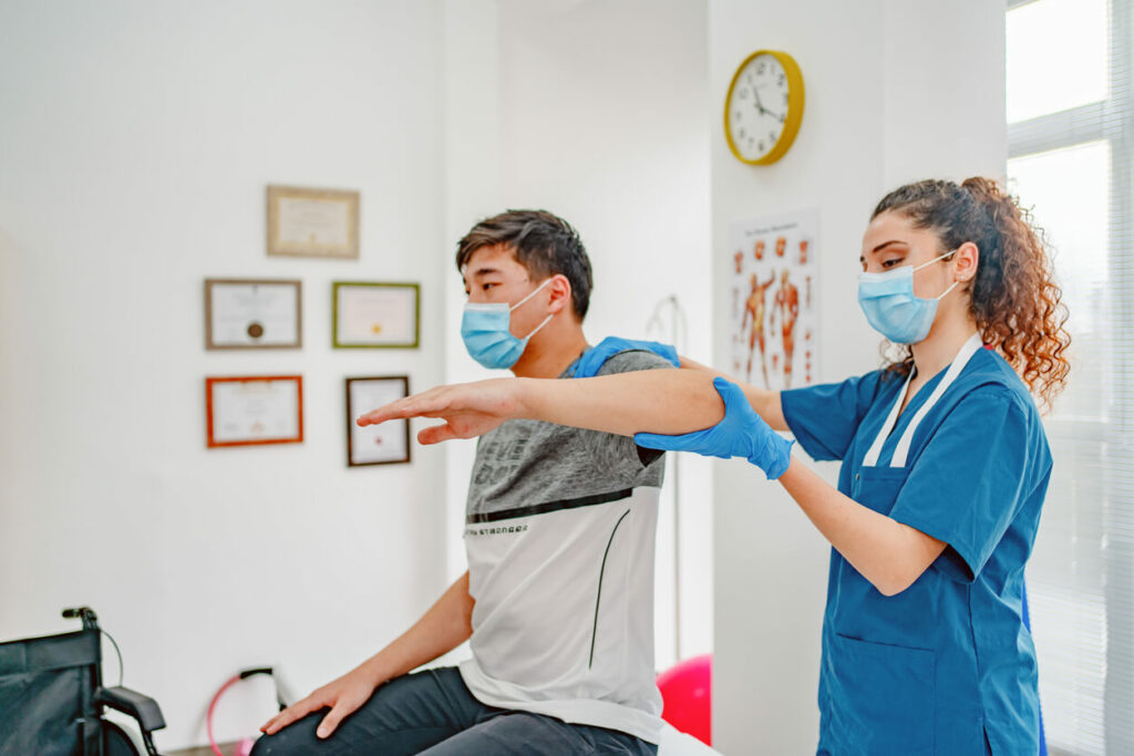 a patient being examined by a doctor at an orthopedic clinic