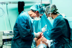 A team of orthopedic surgeons is operating on a patient at the surgery center.
