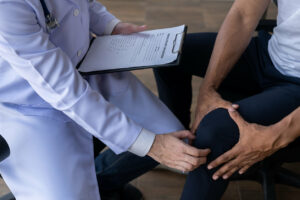 A man arrives at the orthopedist's office complaining of knee pain.